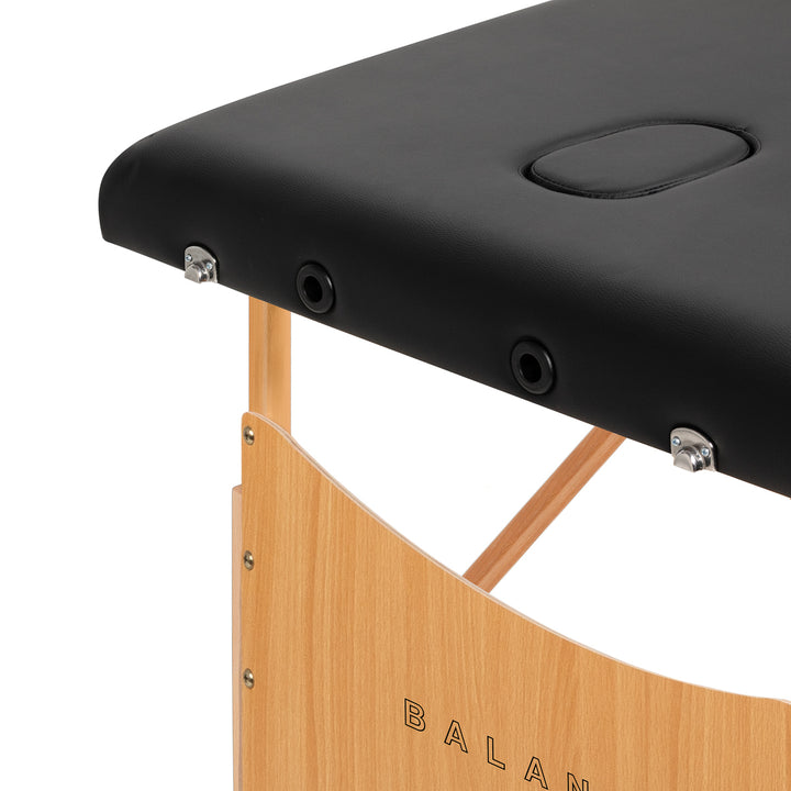 Camilla de masaje plegable de madera de haya Balance 2 zonas negro